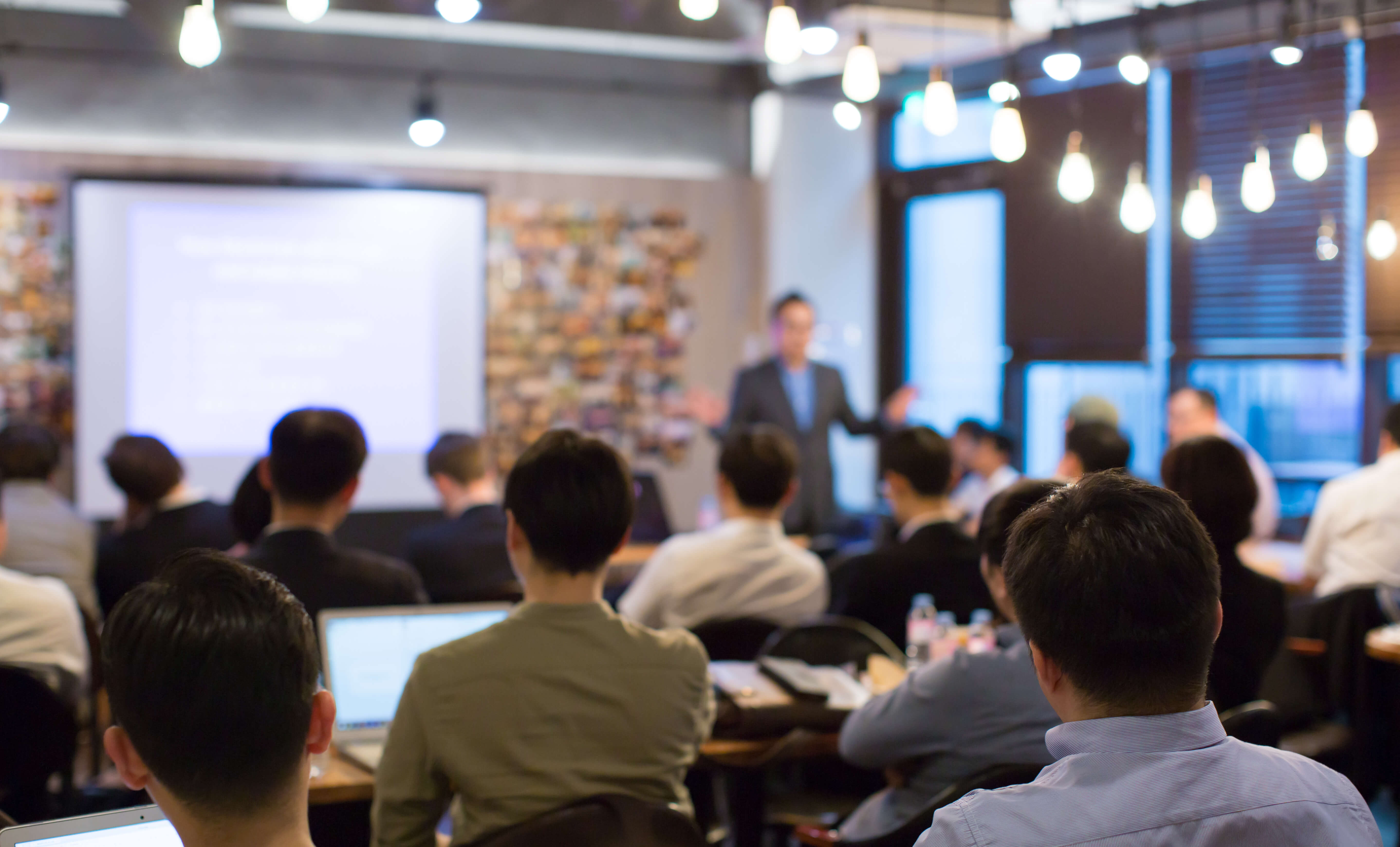 Business People Meeting and Working while Business Executive Lead Presenter Speaks to Group of Successful Technology Entrepreneurs. Consultant Advisor. Growth Training Lecture. Defocused Blurred Business People Meeting and Working while Business Executive Lead Presenter Speaks to Group of Successful Technology Entrepreneurs. Consultant Advisor. Growth Training Lecture. Defocused Blurred